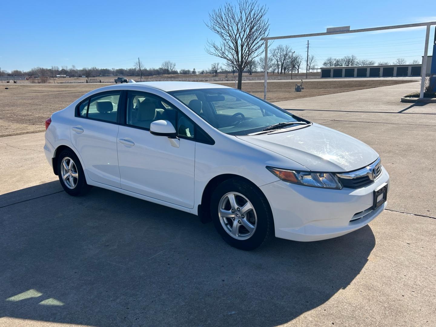 2012 White /Gray Honda Civic CNG Sedan 5-Speed AT (19XFB5F58CE) with an 1.8L L4 SOHC 16V CNG engine, 5-Speed Automatic transmission, located at 17760 Hwy 62, Morris, OK, 74445, (918) 733-4887, 35.609104, -95.877060 - 2012 HONDA CIVIC 1.8L FWD DEDICATED CNG (COMPRESSED NATURAL GAS) VEHICLE. FEATURES REMOTE KEYLESS ENTRY, POWER LOCKS, POWER WINDOWS, POWER MIRRORS, MANUEL SEATS, AM/FM RADIO, CD PLAYER, USB, AUX, BLUETOOTH FOR HANDS-FREE CALLING, 12V POWER OUTLET, CRUISE CONTROL, TRACTION CONTROL, CLOTH SEATS, 195/6 - Photo#2